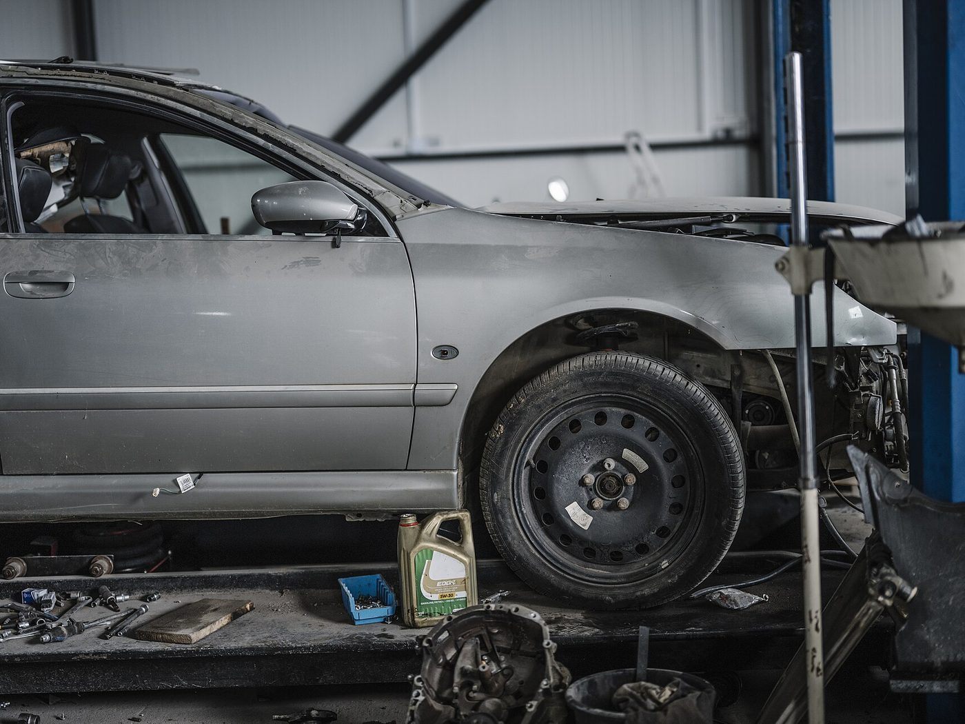 A car on a lift in the shop